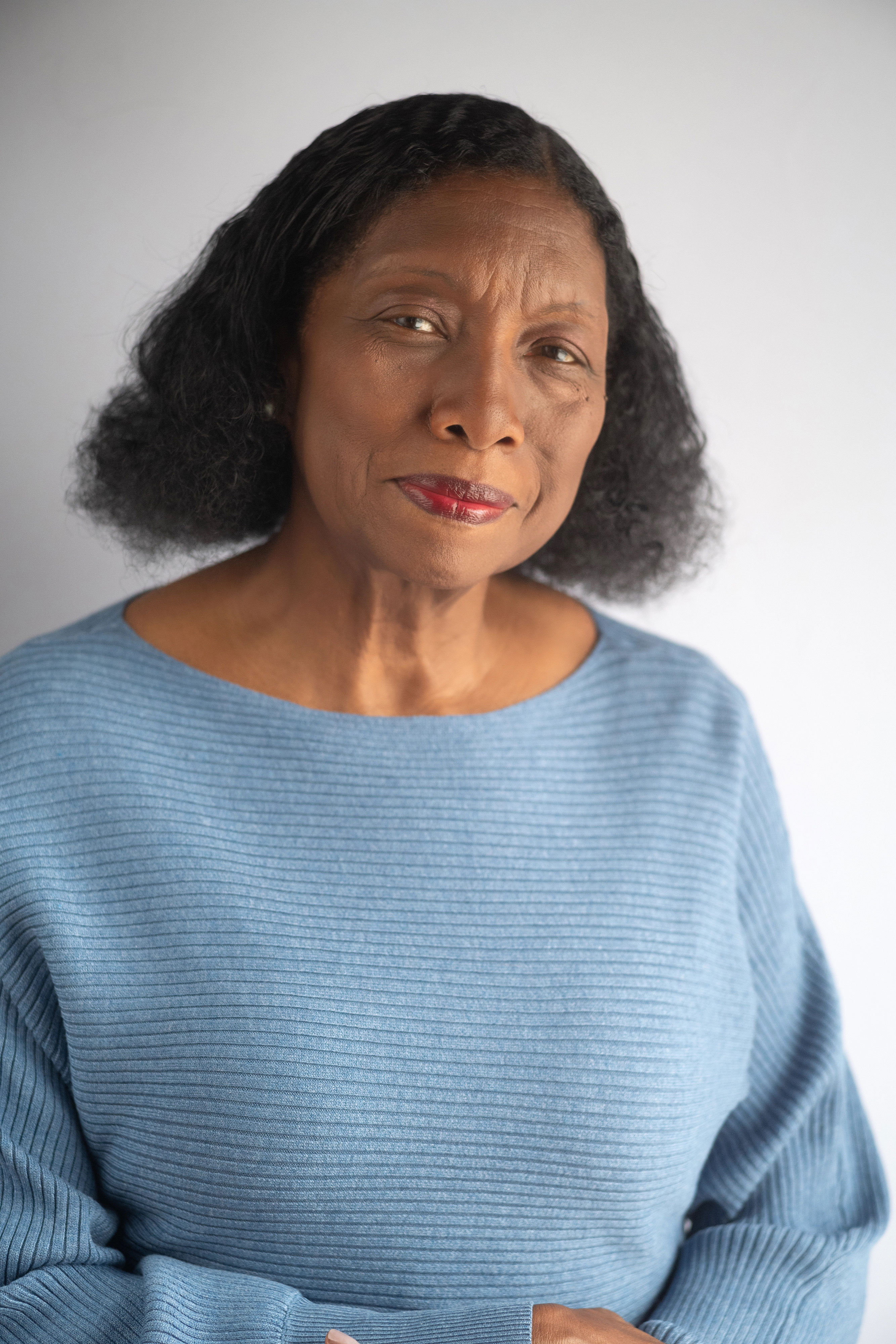 Lynette head shot in blue